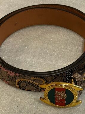 Gucci Brown GG Canvas Belt with Gold Tiger Emblem and Green-Red Stripe.